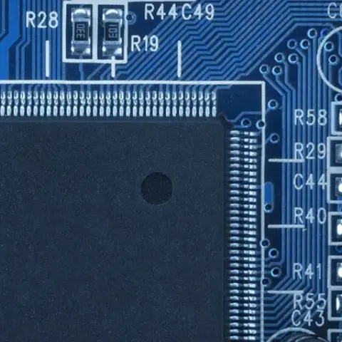 Clost up of blue circuit board and semiconductor wafer