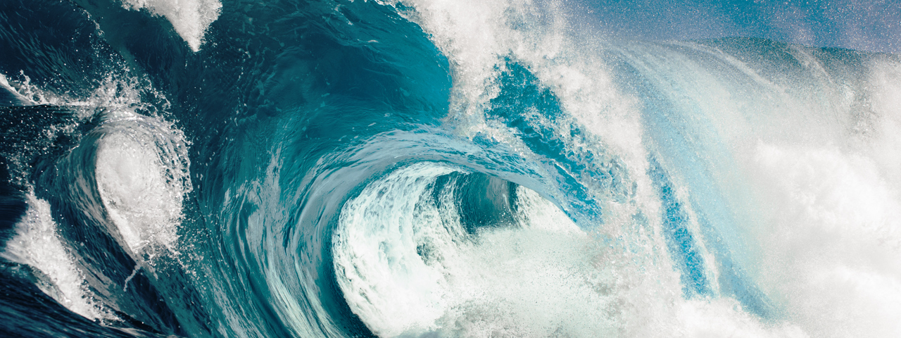 Large wave crashing in sea